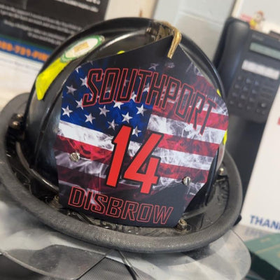 Helmet with 'Southport 14 Disbrow' design on a blurred background