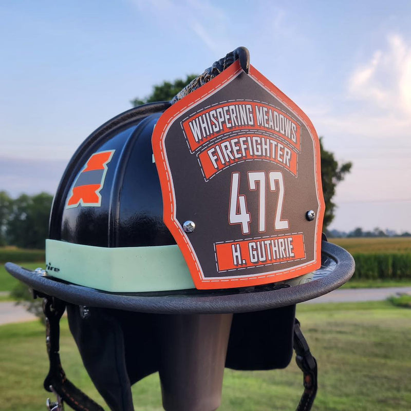 Firefighter helmet with personalized details on a stand outdoors