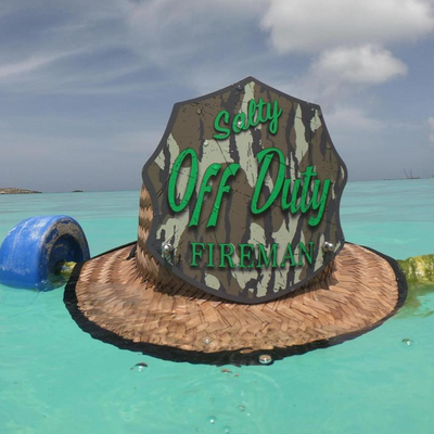 Hat with 'Off Duty Fireman' text floating in clear blue water with a cloudy sky.