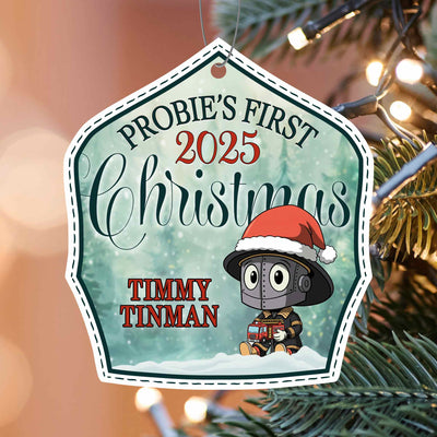 Christmas ornament with 'Probie's First 2025 Christmas' text and a cartoon tin man on a tree.