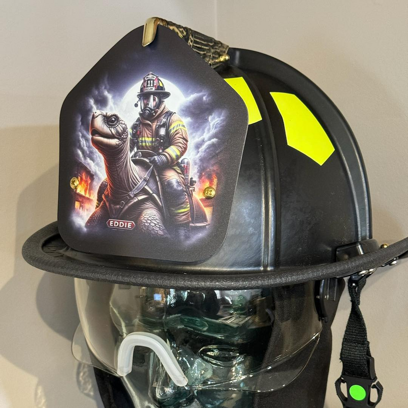 Firefighter helmet with a graphic design on the front, displayed on a mannequin head.